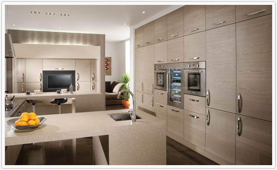 The light, airy feel of Cinnamon is given added depth by the unique horizontal grain of the Tavola design. Curved doors and a modern cornice, seen here incorporated into a floating wall unit, add to the ethereal feel, putting this kitchen in a class of its own.